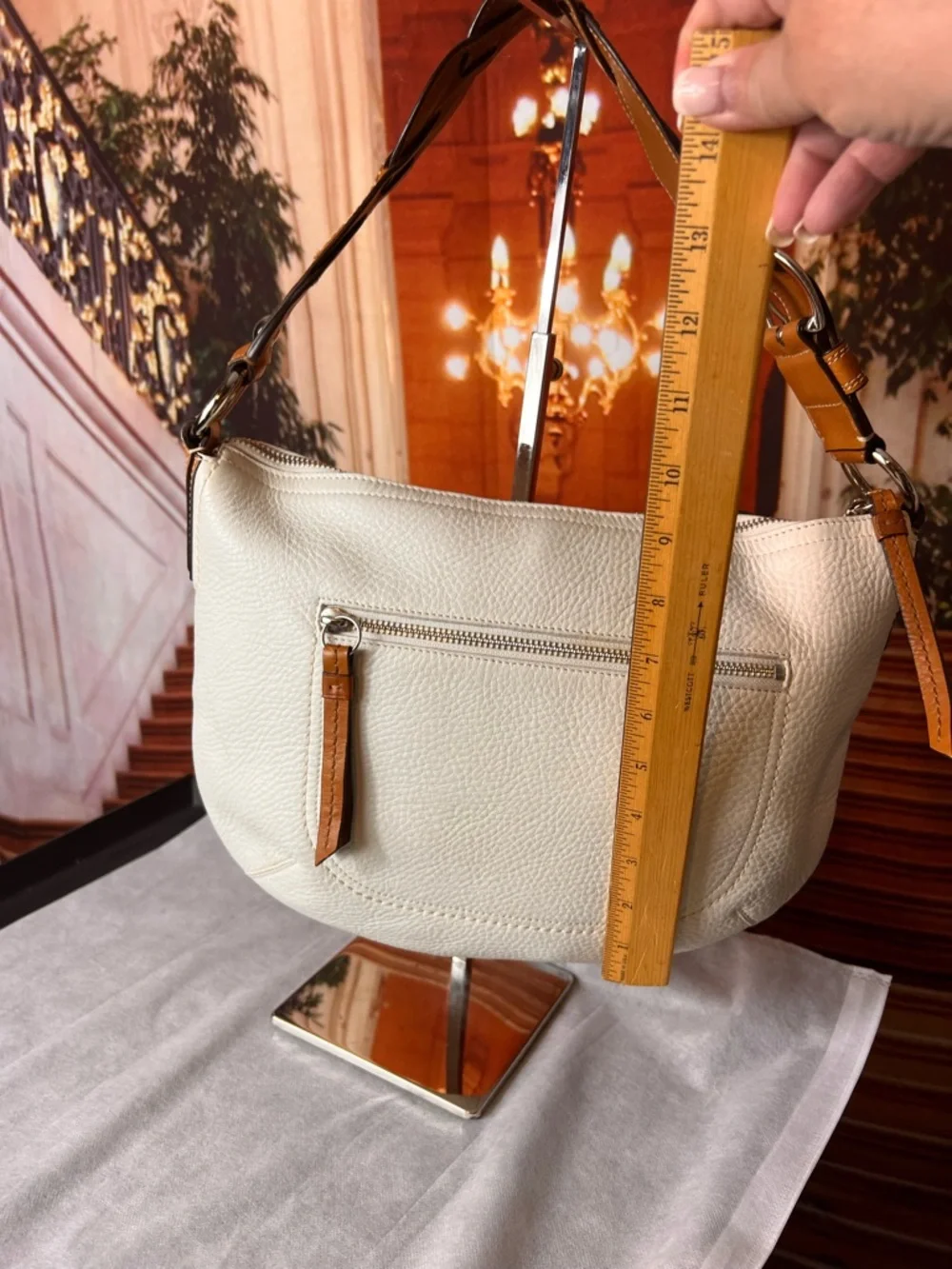 Coach Soho White Pebbled Leather Hobo bag features a distinctive braided handle